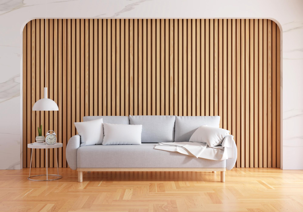 Wooden wall with slats and a couch in front