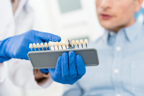 Dentist showing dental implants to a patient