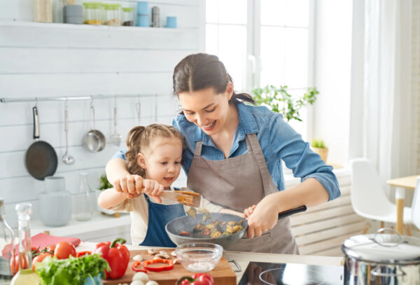 Mother and child cooking in the kitchen