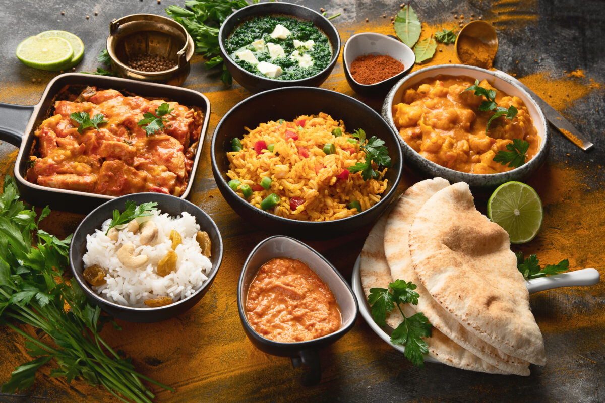 Indian food in bowls and plates on a table