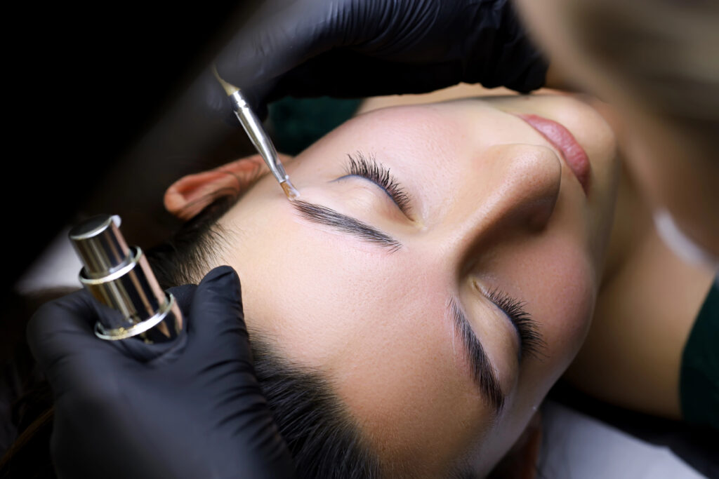 Woman getting brow treatment