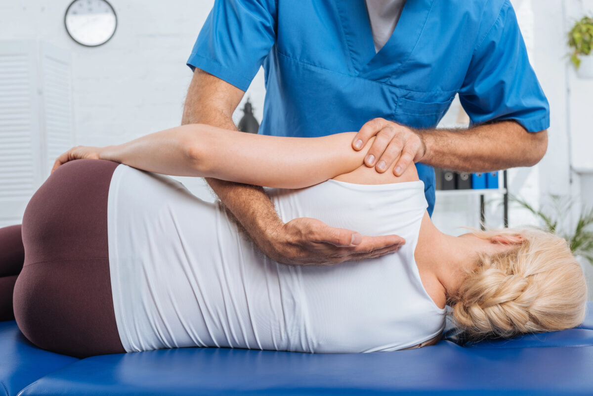 Chiropractor working on a patient's back