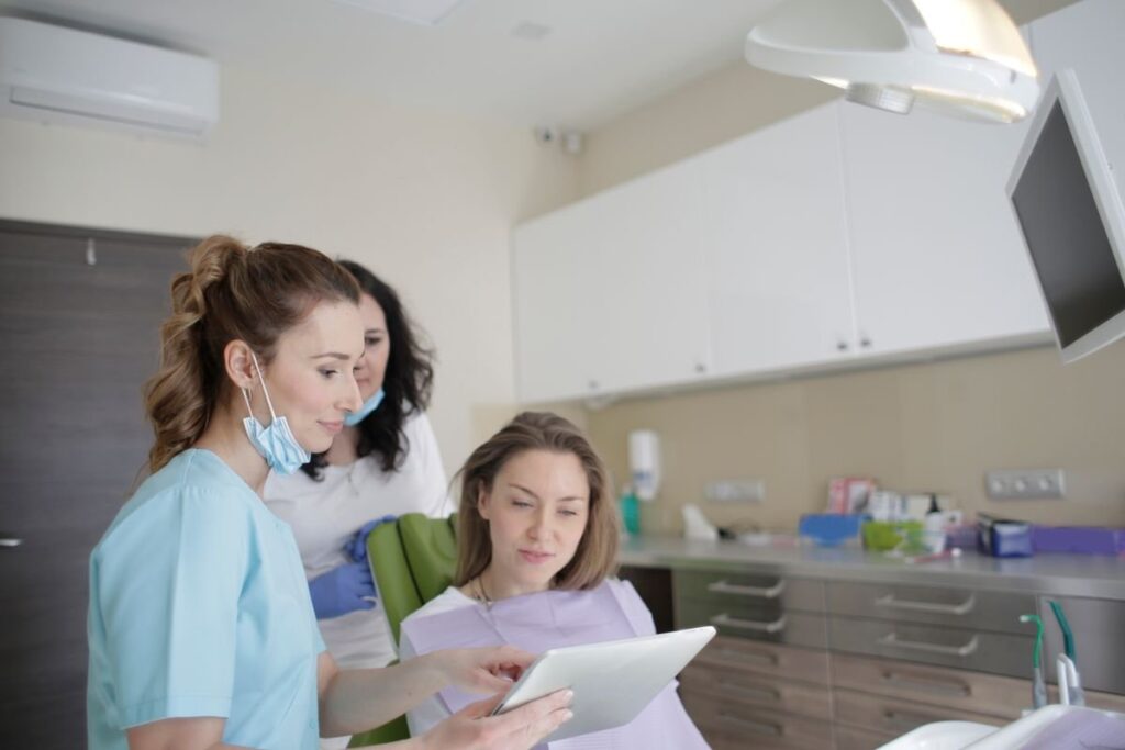Patient and dental staff in a surgery